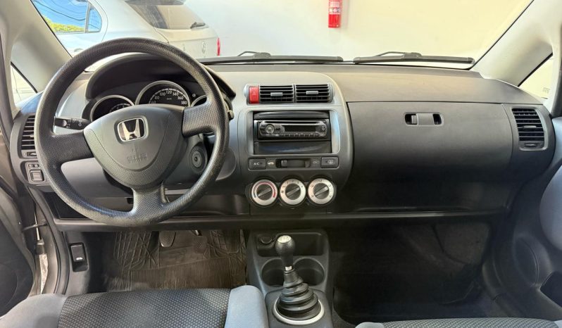 
								honda fit cheio									