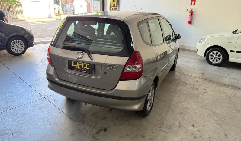 
								honda fit cheio									